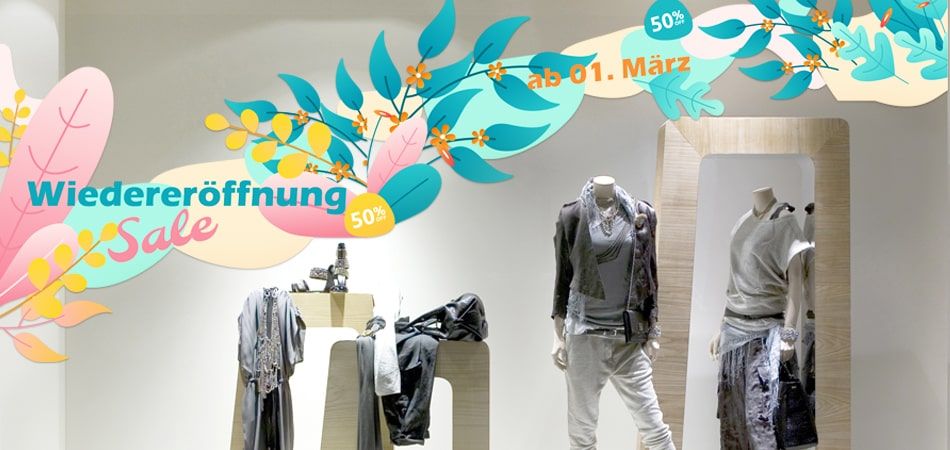 Ankündigung einer Wiedereröffnung mit Schaufenster Klebefolien.